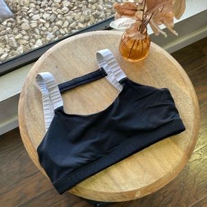 Born primitive Black with white sports bra.